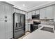 Well-equipped kitchen with gray cabinets, stainless steel appliances, and ample counter space at 1749 Culbertson Ave. # 1749, Myrtle Beach, SC 29577