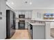 Modern kitchen featuring stainless steel appliances, gray cabinetry, and an open layout at 1749 Culbertson Ave. # 1749, Myrtle Beach, SC 29577