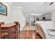 Open floor plan with a dining area and kitchen view, featuring hardwood floors and neutral tones at 1749 Culbertson Ave. # 1749, Myrtle Beach, SC 29577