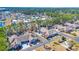 Aerial view of brick homes with lush trees in a well-maintained community at 2019 Balfour Ct. # L4, Myrtle Beach, SC 29575