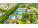 Community aerial view showcasing the pool and tennis facilities nestled between houses and tree lined streets at 2019 Balfour Ct. # L4, Myrtle Beach, SC 29575