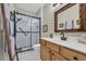 Modern bathroom with white subway tiles, a glass-enclosed shower, and a wood vanity at 2019 Balfour Ct. # L4, Myrtle Beach, SC 29575