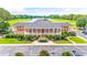 Stately community clubhouse overlooking a lake and a golf course surrounded by lush landscaping at 2019 Balfour Ct. # L4, Myrtle Beach, SC 29575