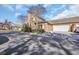 Brick townhome exterior with well-maintained landscaping, two-car garage, and blue sky at 2019 Balfour Ct. # L4, Myrtle Beach, SC 29575