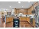 Kitchen featuring an island, wooden cabinets, stainless steel appliances, and granite countertops at 2019 Balfour Ct. # L4, Myrtle Beach, SC 29575