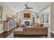 Cozy living room features a fireplace, large windows and comfortable sectional couch at 2019 Balfour Ct. # L4, Myrtle Beach, SC 29575