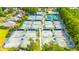 Overhead view of multiple outdoor tennis courts in a community, surrounded by mature trees and greenery at 2019 Balfour Ct. # L4, Myrtle Beach, SC 29575