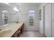 Bathroom features a dual sink vanity, mirror, and a window at 206B 56Th Ave. N, North Myrtle Beach, SC 29582
