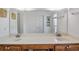 Bright bathroom features double sinks, decorative wall art, and a large mirror at 206B 56Th Ave. N, North Myrtle Beach, SC 29582