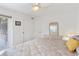 Bedroom with ceiling fan, outside access, and wicker furniture at 206B 56Th Ave. N, North Myrtle Beach, SC 29582