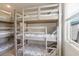 Bedroom with bunkbeds featuring comfortable bedding and lots of sunlight at 206B 56Th Ave. N, North Myrtle Beach, SC 29582