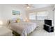 Cozy bedroom with ceiling fan, neutral decor, and a sliding glass door to the outside at 206B 56Th Ave. N, North Myrtle Beach, SC 29582
