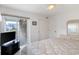 Bedroom featuring a television, access to the outside, and wicker furniture at 206B 56Th Ave. N, North Myrtle Beach, SC 29582