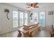 Eat-in kitchen features lots of natural light, dining table with bench seating, and stylish decor at 206B 56Th Ave. N, North Myrtle Beach, SC 29582