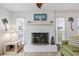 Bright living room featuring a decorative white brick fireplace and lots of natural light at 206B 56Th Ave. N, North Myrtle Beach, SC 29582