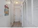 Hallway with multiple storage closets and a decorative sign at 206B 56Th Ave. N, North Myrtle Beach, SC 29582