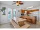 Eat-in kitchen features wooden cabinetry, dining table with bench seating, and lots of natural light at 206B 56Th Ave. N, North Myrtle Beach, SC 29582