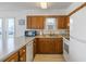 This well-lit kitchen features wood cabinets, modern appliances, and light countertops at 206B 56Th Ave. N, North Myrtle Beach, SC 29582