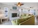 Bright living room features a white brick fireplace, stylish furnishings, and lots of natural light at 206B 56Th Ave. N, North Myrtle Beach, SC 29582
