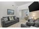 Comfortable living room features modern couches, TV, and bright natural light at 206B 56Th Ave. N, North Myrtle Beach, SC 29582