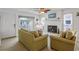 Bright living room features a fireplace, stylish furnishings, and sliding door access to the outside at 206B 56Th Ave. N, North Myrtle Beach, SC 29582