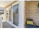 Charming front porch with chair, ambient lighting, and view of the sliding glass door entrance at 206B 56Th Ave. N, North Myrtle Beach, SC 29582