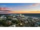 Aerial view of a beach home at sunset, showcasing its proximity to the ocean and local attractions at 214 2Nd Ave. S, North Myrtle Beach, SC 29582