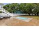 Inviting backyard with a small in-ground pool, seating, and mature trees at 214 2Nd Ave. S, North Myrtle Beach, SC 29582