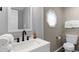 Stylish bathroom with a modern vanity, elegant mirror, and convenient toilet at 214 2Nd Ave. S, North Myrtle Beach, SC 29582