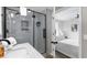 Bathroom sink with a shower featuring glass doors and black hardware and an adjoining bedroom at 214 2Nd Ave. S, North Myrtle Beach, SC 29582