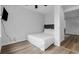 Bedroom with wood-look floors, ceiling fan, and a comfortable bed at 214 2Nd Ave. S, North Myrtle Beach, SC 29582
