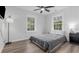 Comfortable bedroom with two windows, ceiling fan, and stylish furnishings at 214 2Nd Ave. S, North Myrtle Beach, SC 29582