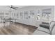 Bright game room with hardwood floors, ping pong table, and comfortable seating at 214 2Nd Ave. S, North Myrtle Beach, SC 29582