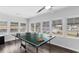 Bright game room with hardwood floors, ping pong table, and many windows at 214 2Nd Ave. S, North Myrtle Beach, SC 29582