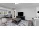 Cozy living room with neutral tones and an area rug, offering a comfortable space at 214 2Nd Ave. S, North Myrtle Beach, SC 29582