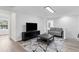 Cozy living room with neutral tones and an area rug, offering a comfortable space at 214 2Nd Ave. S, North Myrtle Beach, SC 29582