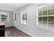 Bright, airy room featuring three large windows and modern floors at 214 2Nd Ave. S, North Myrtle Beach, SC 29582