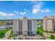 Stunning aerial view of a condominium complex boasting lush lawns, marina and resort-style swimming pools at 2151 Bridge View Ct. # 1-803, North Myrtle Beach, SC 29582