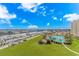 Breathtaking aerial shot showcases the waterway, community pool, and lush landscaping surrounding the property at 2151 Bridge View Ct. # 1-803, North Myrtle Beach, SC 29582