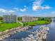 Aerial view of condo building with a marina on the waterfront, showcasing coastal living at 2151 Bridge View Ct. # 1-803, North Myrtle Beach, SC 29582