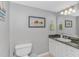 Bathroom features a single sink vanity with granite countertops, decor, and a toilet at 2151 Bridge View Ct. # 1-803, North Myrtle Beach, SC 29582