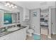 Bright bathroom with granite countertops, vanity with storage, large mirror, shower and tiled floors at 2151 Bridge View Ct. # 1-803, North Myrtle Beach, SC 29582