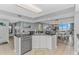 Bright and open kitchen with stainless steel appliances and island overlooking the dining and living areas at 2151 Bridge View Ct. # 1-803, North Myrtle Beach, SC 29582