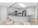 Well-lit kitchen with stainless steel appliances, breakfast bar, and stylish decor at 2151 Bridge View Ct. # 1-803, North Myrtle Beach, SC 29582