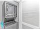 Convenient laundry area with stackable washer and dryer, maximizing space at 2151 Bridge View Ct. # 1-803, North Myrtle Beach, SC 29582