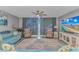 Inviting living room with waterfront view, stylish furnishings, and entertainment center at 2151 Bridge View Ct. # 1-803, North Myrtle Beach, SC 29582