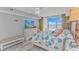 This main bedroom features a sliding glass door with access to the balcony with views of the waterway at 2151 Bridge View Ct. # 1-803, North Myrtle Beach, SC 29582