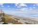 Serene view of a sandy beach with a wooden boardwalk, offering direct access to the soothing ocean waves at 2600 S Ocean Blvd. # 215, Myrtle Beach, SC 29577