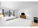 Bedroom with two beds, a TV on the bureau, light-colored hard wood floors and a window at 2600 S Ocean Blvd. # 215, Myrtle Beach, SC 29577
