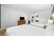The bedroom is furnished with two beds, a TV on bureau and an adjacent kitchenette with white walls at 2600 S Ocean Blvd. # 215, Myrtle Beach, SC 29577